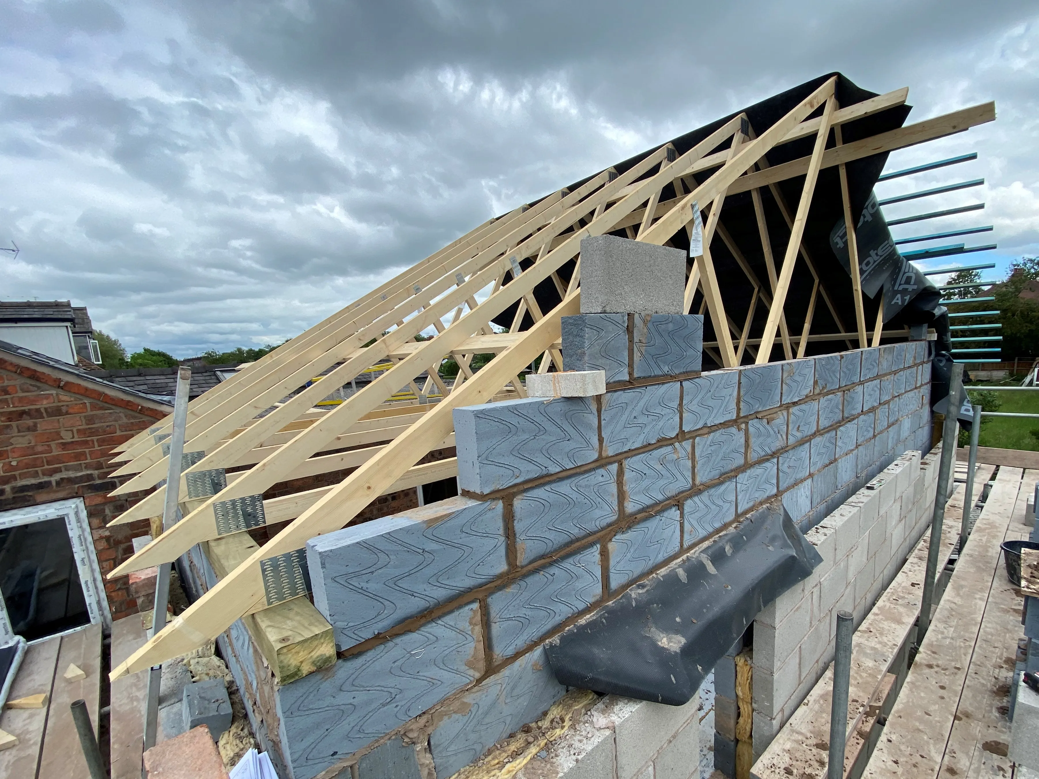 a house under construction with a roof being built