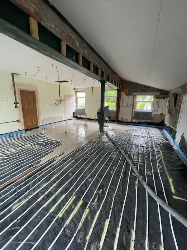 a large room with a floor heating system in the middle of it