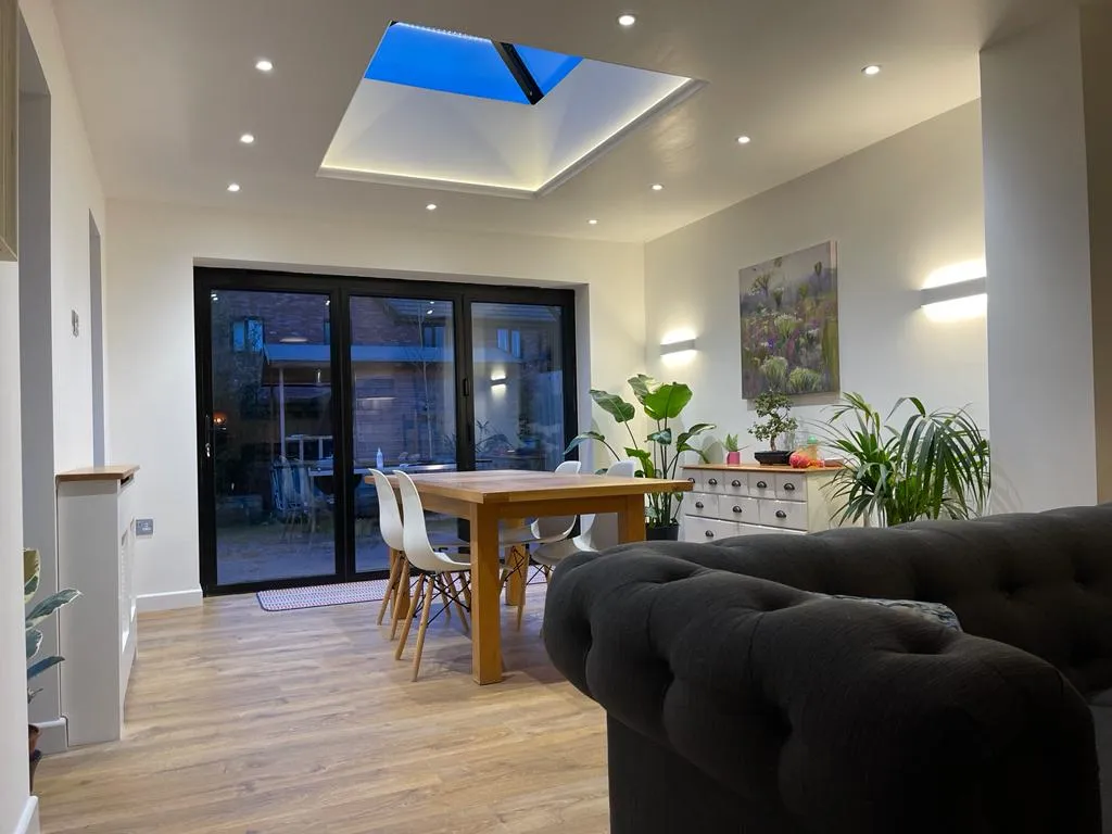 a living room filled with furniture and a wooden table