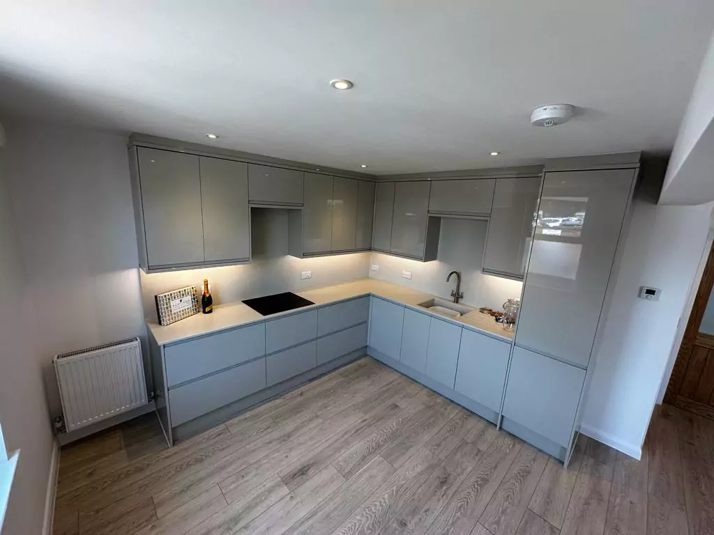 a kitchen with a stove top oven sitting next to a sink