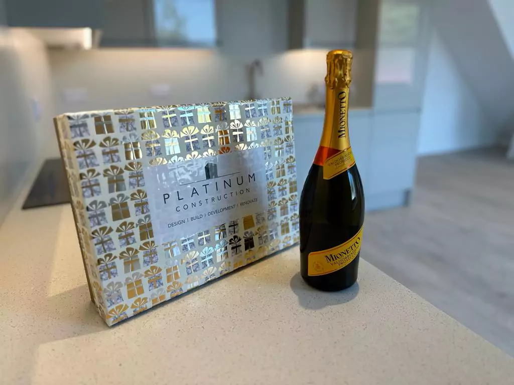 an award and a bottle of champagne